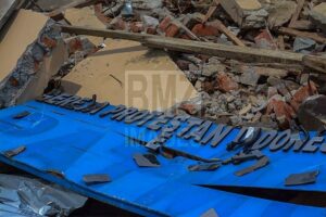 Papan nama gereja yang terserak di Desa Langaleso. bmzIMAGES/BasriMarzuki