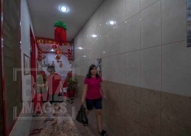 Palu, Central Sulawesi, Indonesia (February 5, 2019): Chinese citizens walk in to pray Lunar New Year in Magabudhi Temple in Palu, Central Sulawesi, Indonesia, Tuesday, February 5, 2019. Citizens of Chinese descent believe the Lunar New Year to 2570 is the year of the pig. The Lunar New Year worship tradition this time took place solemnly because it was still tinged with a post-disaster grief on September 28, 2018 which killed thousands of people. (Photo by Basri Marzuki/bmzIMAGES)