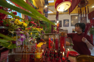 Palu, Central Sulawesi, Indonesia (February 5, 2019): A citizen of Chinese descent puts down incense after praying the Lunar New Year in Magabudhi Temple in Palu, Central Sulawesi, Indonesia, Tuesday, February 5, 2019. Citizens of Chinese descent believe the Lunar New Year to 2570 is the year of the pig. The Lunar New Year worship tradition this time took place solemnly because it was still tinged with a post-disaster grief on September 28, 2018 which killed thousands of people. (Photo by Basri Marzuki/bmzIMAGES)