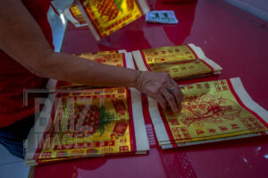 Palu, Central Sulawesi, Indonesia (February 5, 2019): A Chinese citizen prepares equipment to pray for the Lunar New Year in Magabudhi Temple in Palu, Central Sulawesi, Indonesia, Tuesday, February 5 2019. Citizens of Chinese descent believe the Lunar New Year to 2570 is the year of the pig. The Lunar New Year worship tradition this time took place solemnly because it was still tinged with a post-disaster grief on September 28, 2018 which killed thousands of people. (Photo by Basri Marzuki/bmzIMAGES)