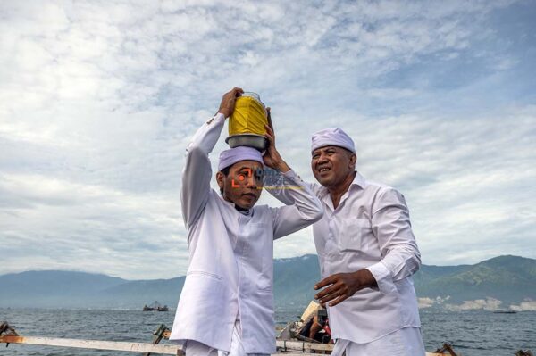 Hindu administrators carry holy water from the sea to be used at the Melasti ritual in Palu, Central Sulawesi, Indonesia, March 10, 2024. The Melasti ceremony which was held the day before Nyepi Day of the 1945 Saka New Year was to raise awareness of the Gods as a manifestation of God Almighty, to wash away people's suffering, eliminate sins, and prevent damage to nature.bmzIMAGES/Basri Marzuki