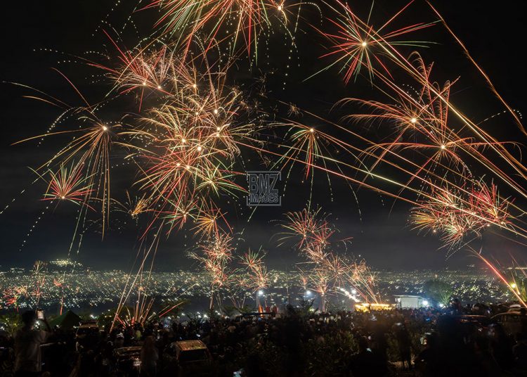 Residents celebrate the New Year with fireworks in Palu, Central Sulawesi, Monday, January 1. Although it had rained, it did not discourage residents from going out of their homes and celebrating the turn of the year from 2023 to 2024. bmzIMAGES/Basri Marzuki